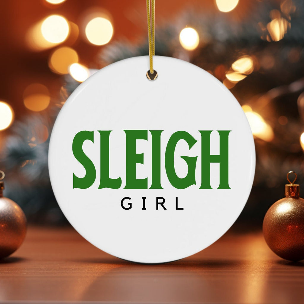 a white ornament with the word sleigh girl on it