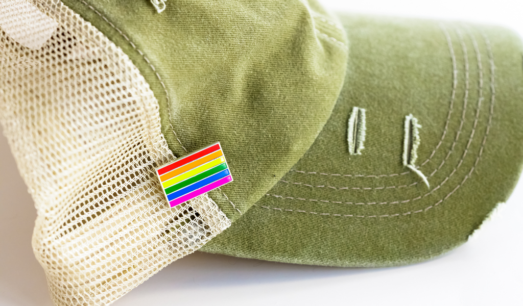 LGBTQ Pride Flag enamel pin on a hat