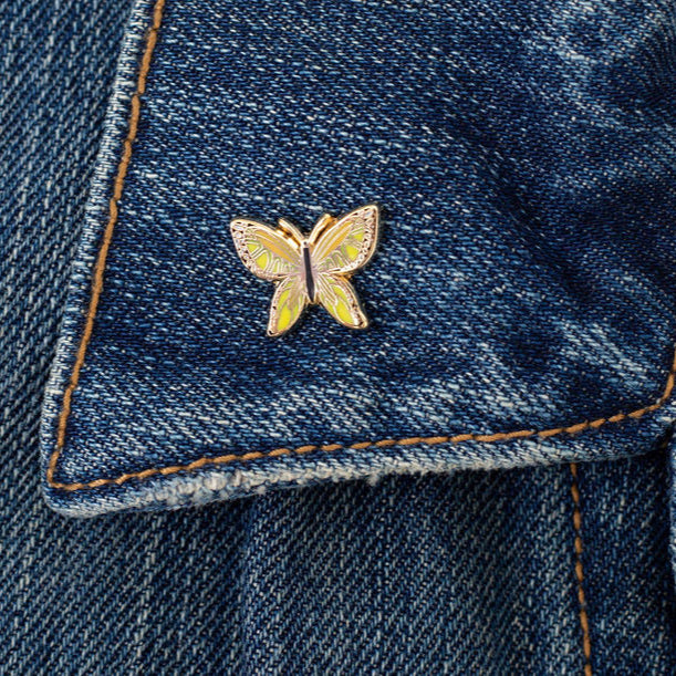 Butterfly pin on a blue denim jacket