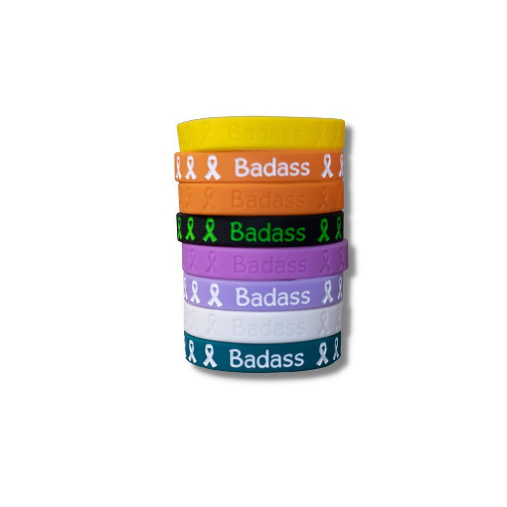 A stack of color options of Badass Wristbands